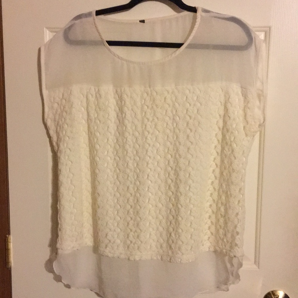 Cream colored blouse.